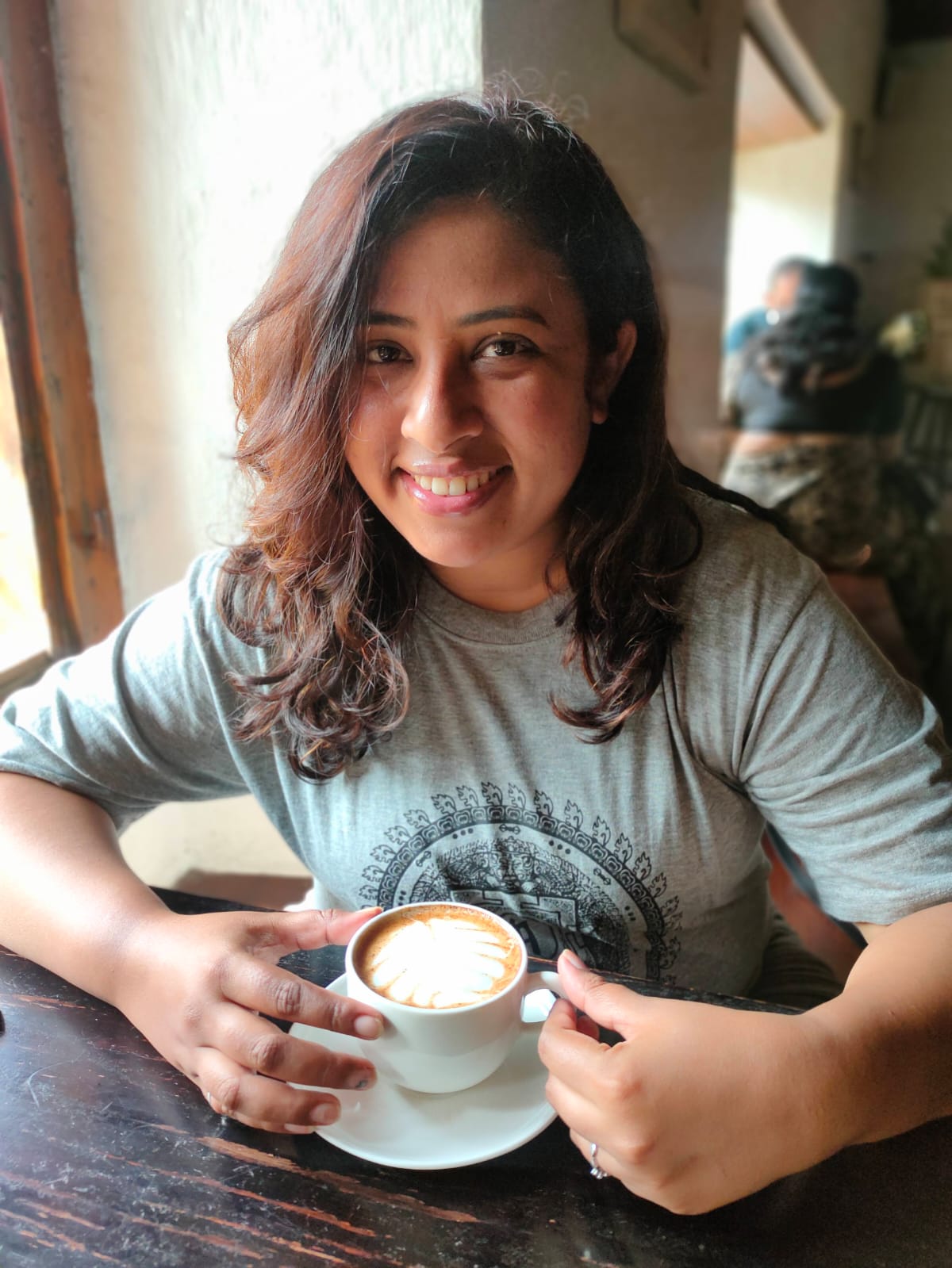 Sneha Dalvi enjoying a coffee while travelling