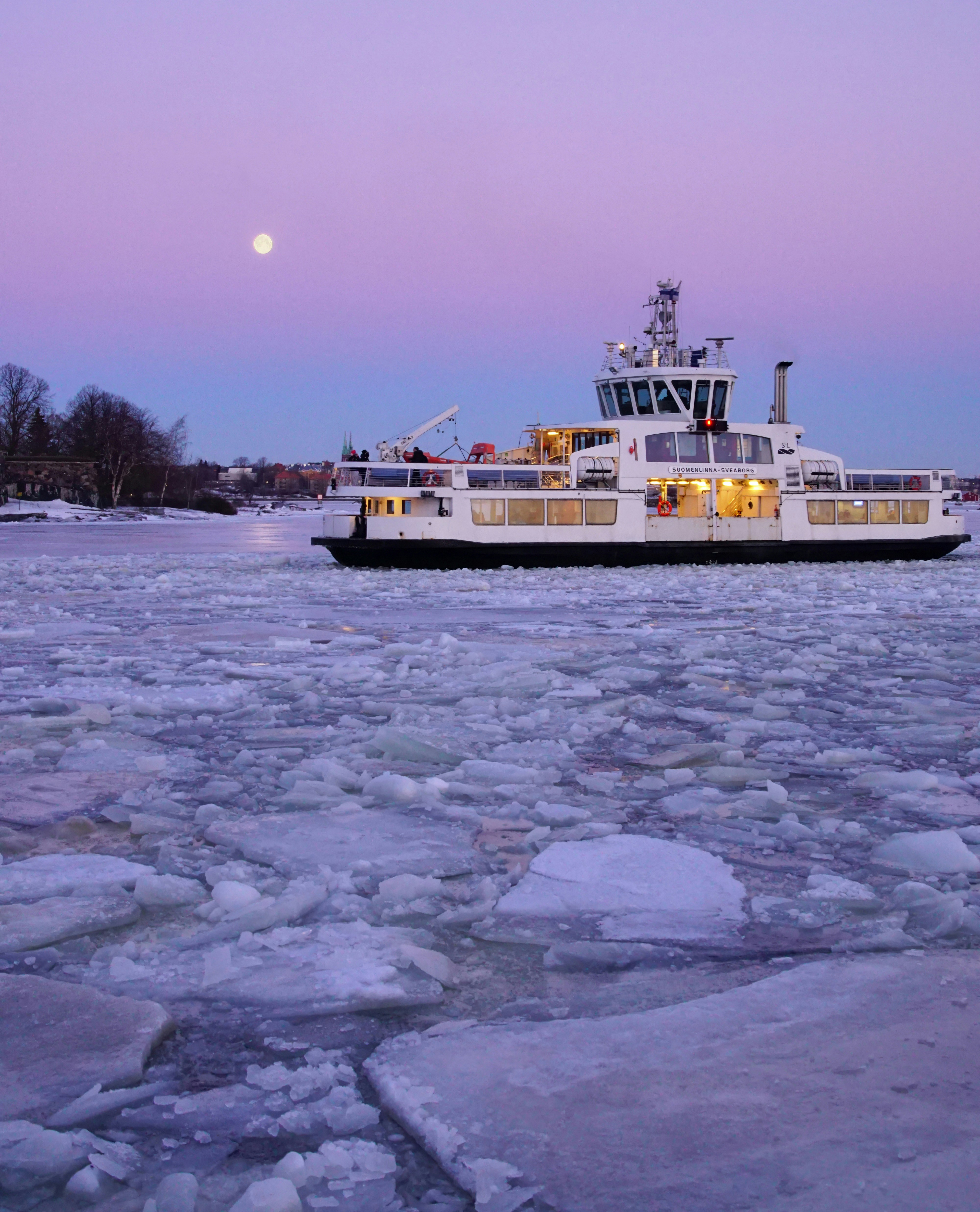 The Suomenlinna–Sveaborg passenger ferry moving through broken sea ice