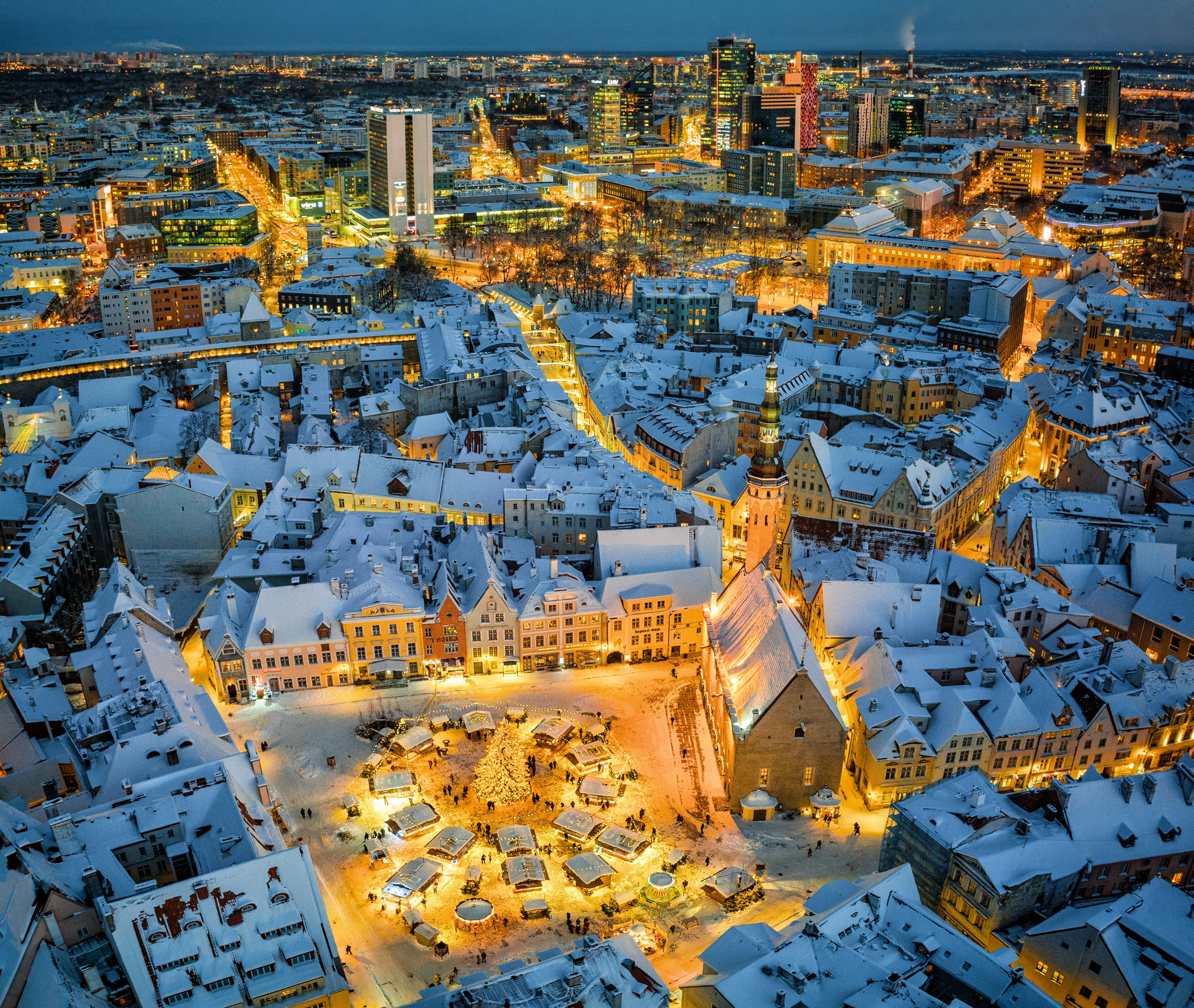 Aerial view of Tallinn’s snow-covered Old Town and Town Hall Square at dusk