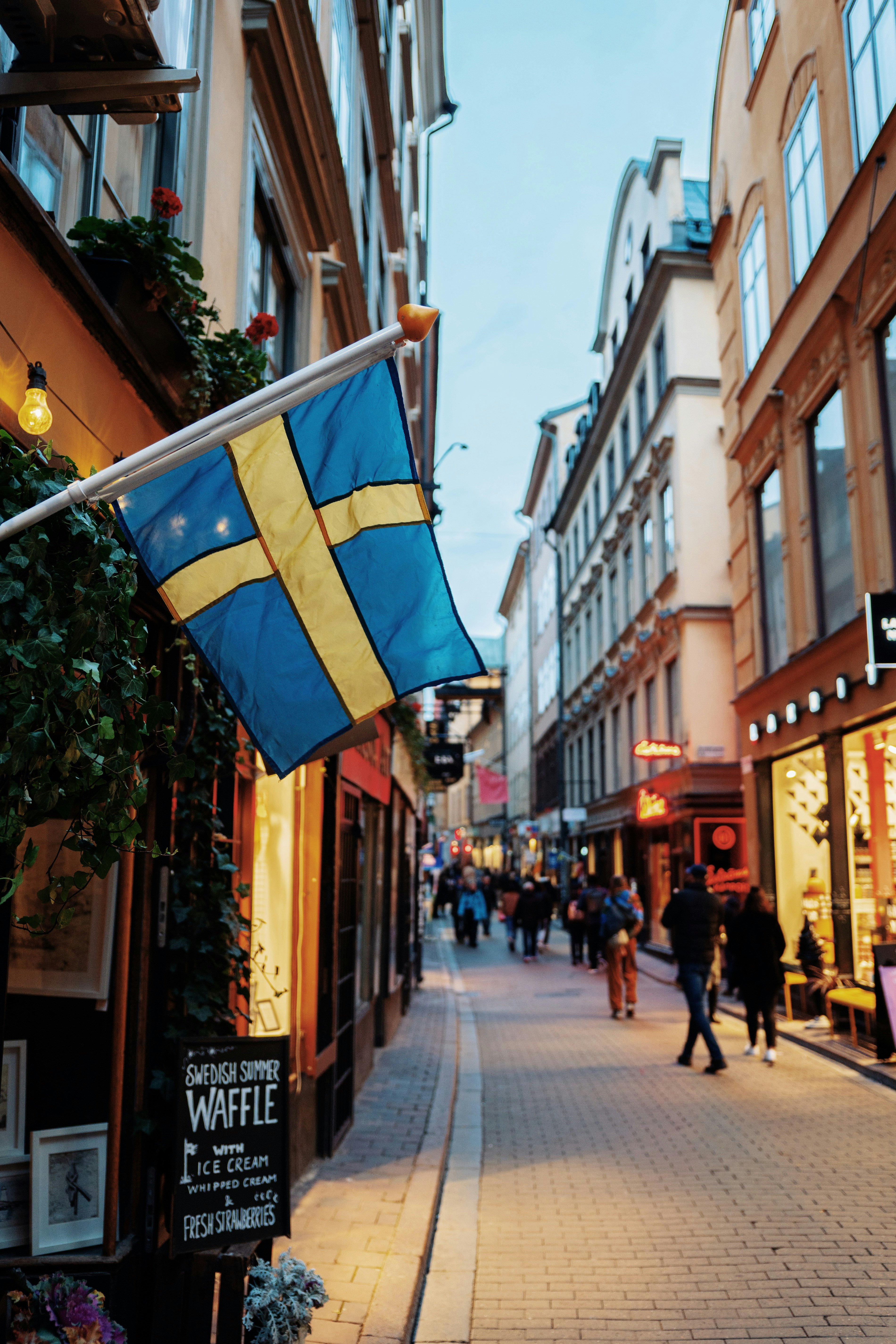 A Swedish flag on a historic street in Stockholm’s Gamla Stan