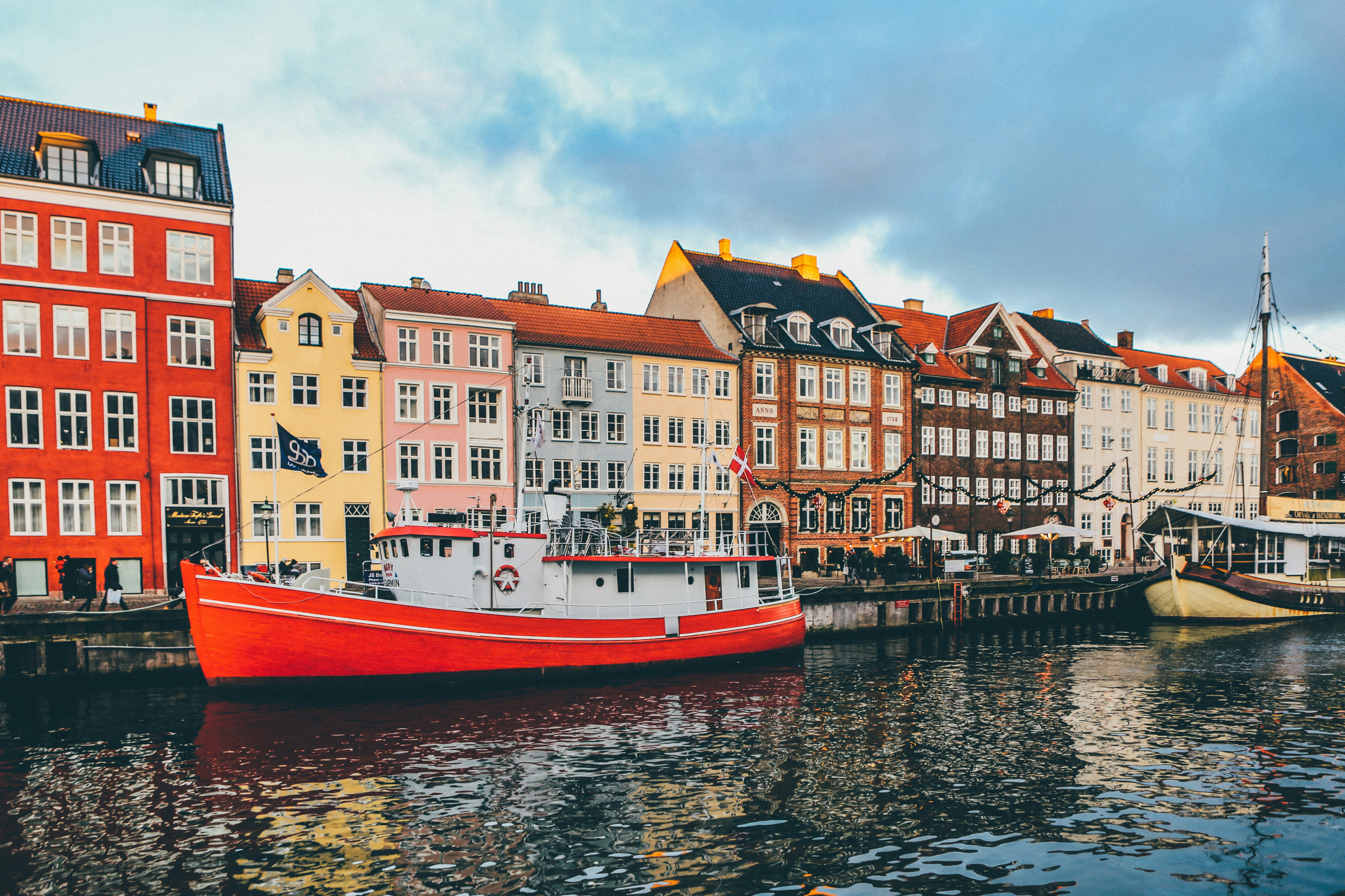 Colourful townhouses and boats along Copenhagen’s Nyhavn canal