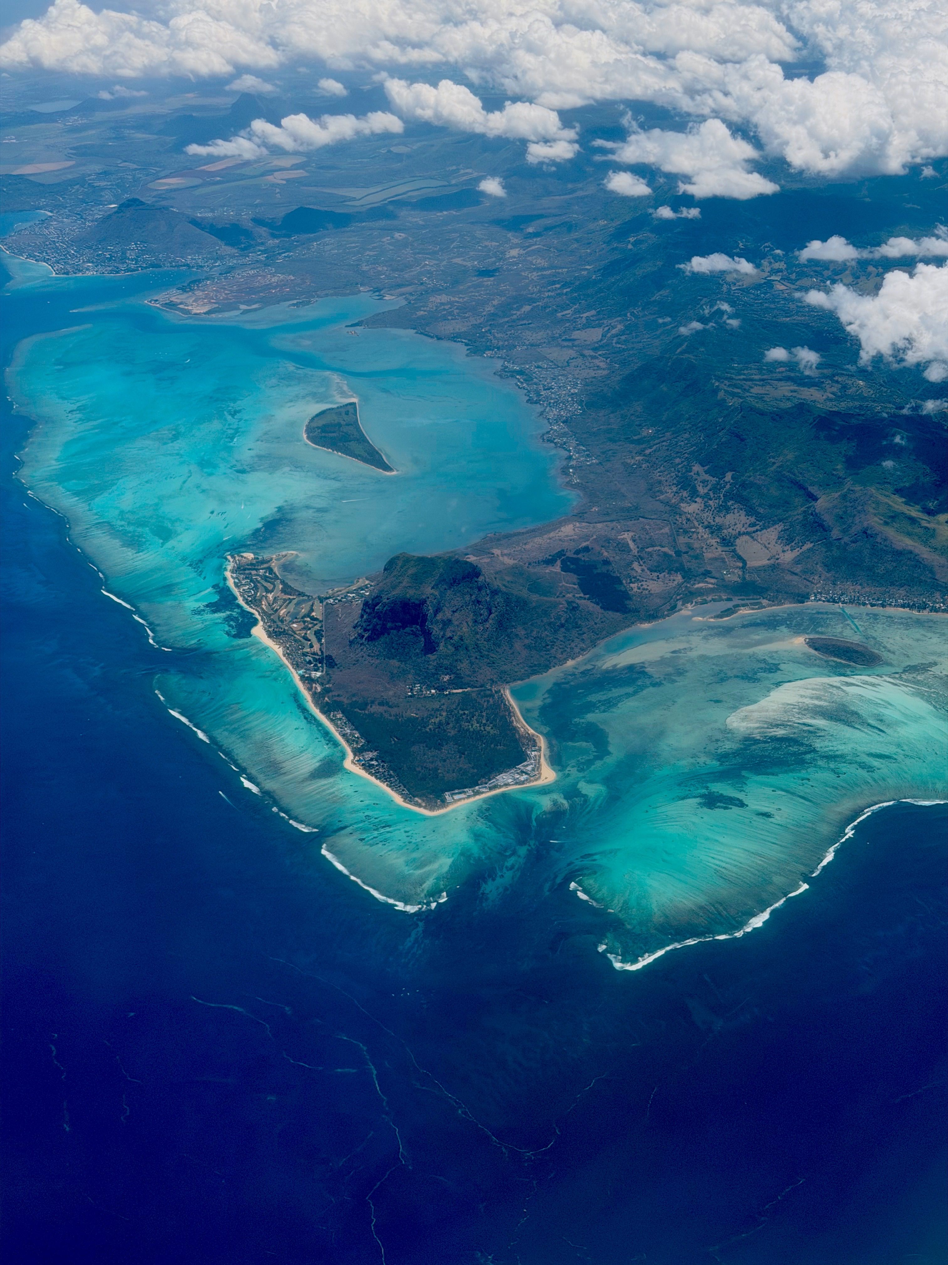 Aerial view of a turquoise lagoon and green coastline in Mauritius