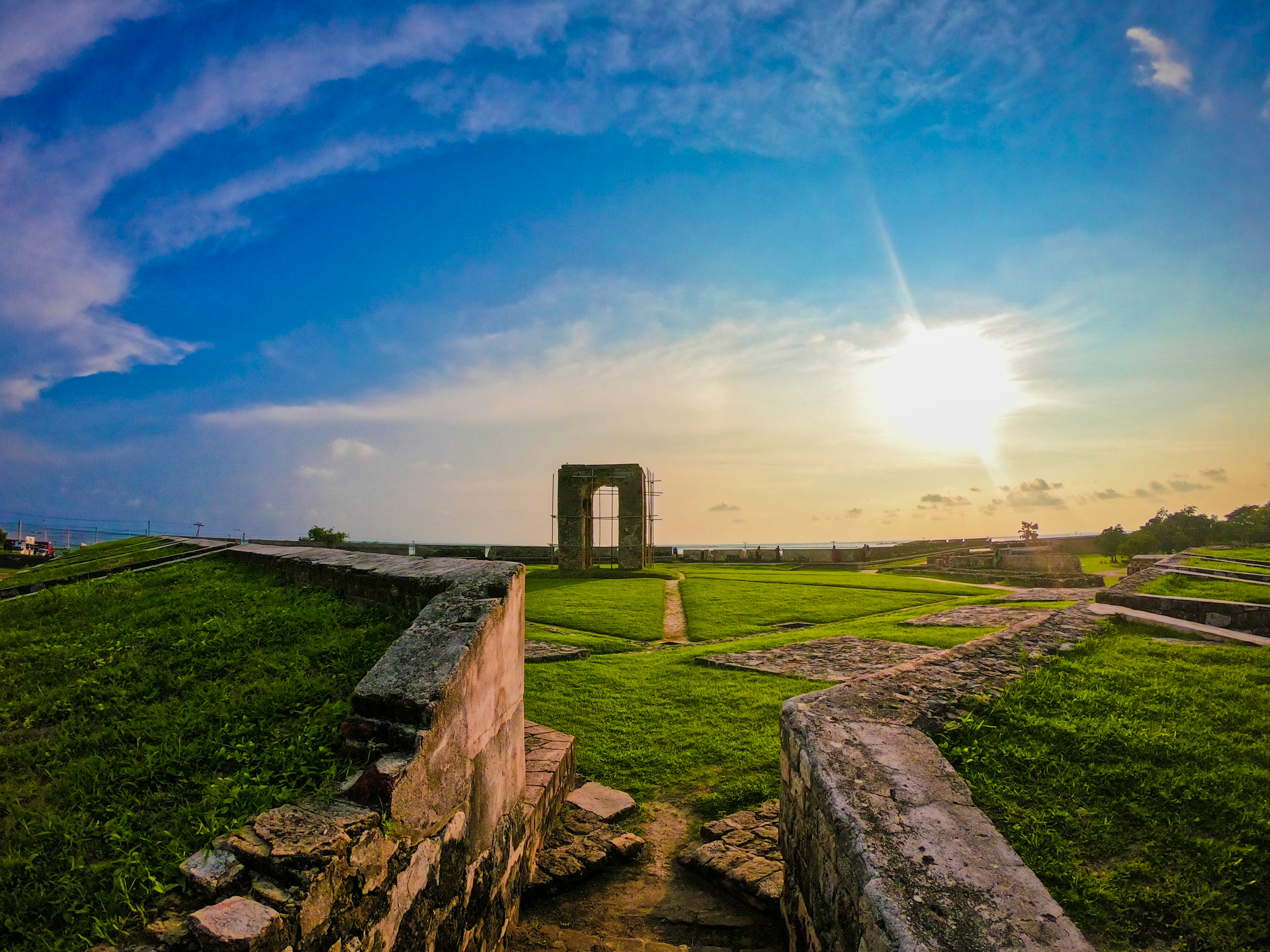 Stone ramparts and grassy grounds at Jaffna Fort