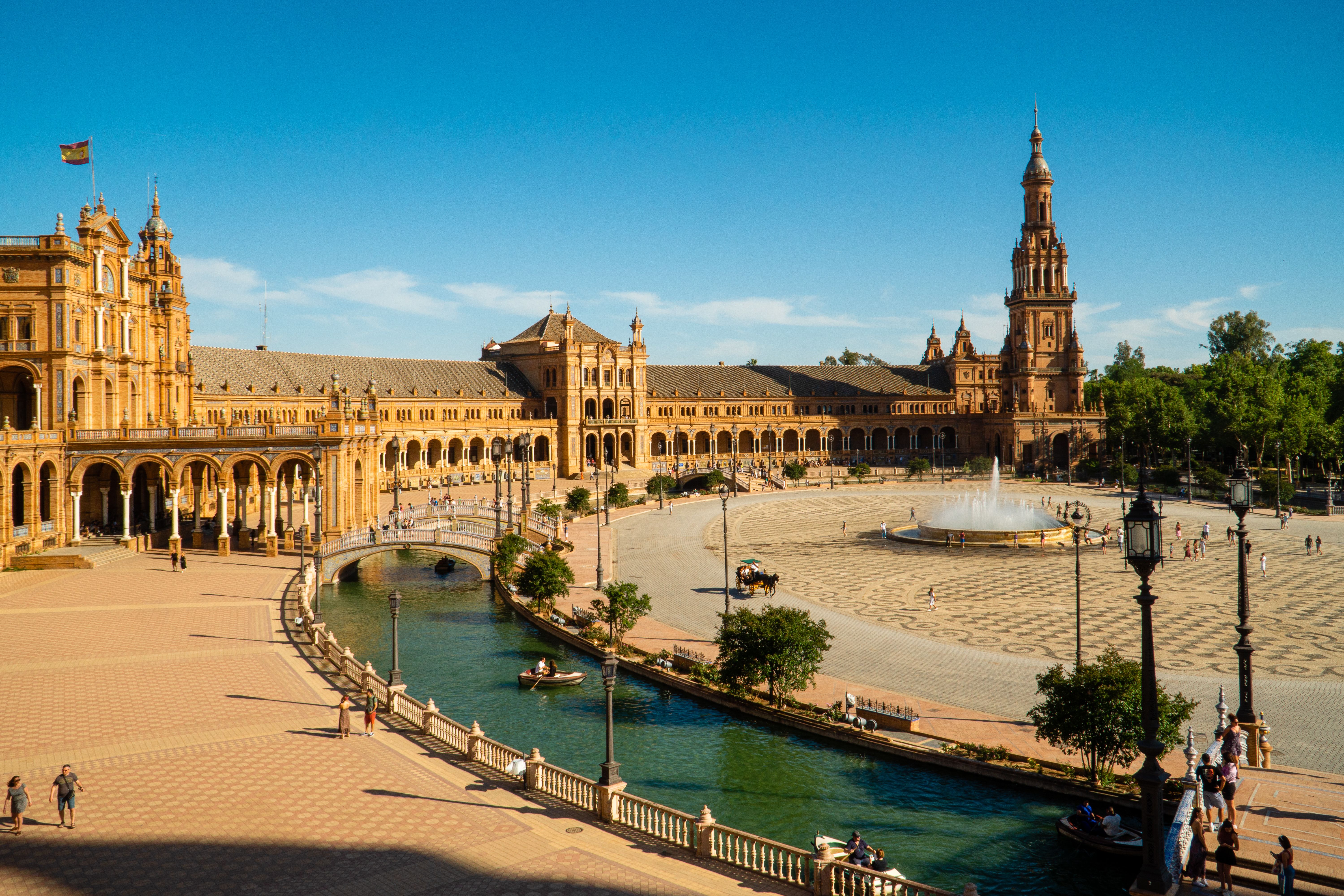 The arcaded plaza and canal at Plaza de España in Seville.