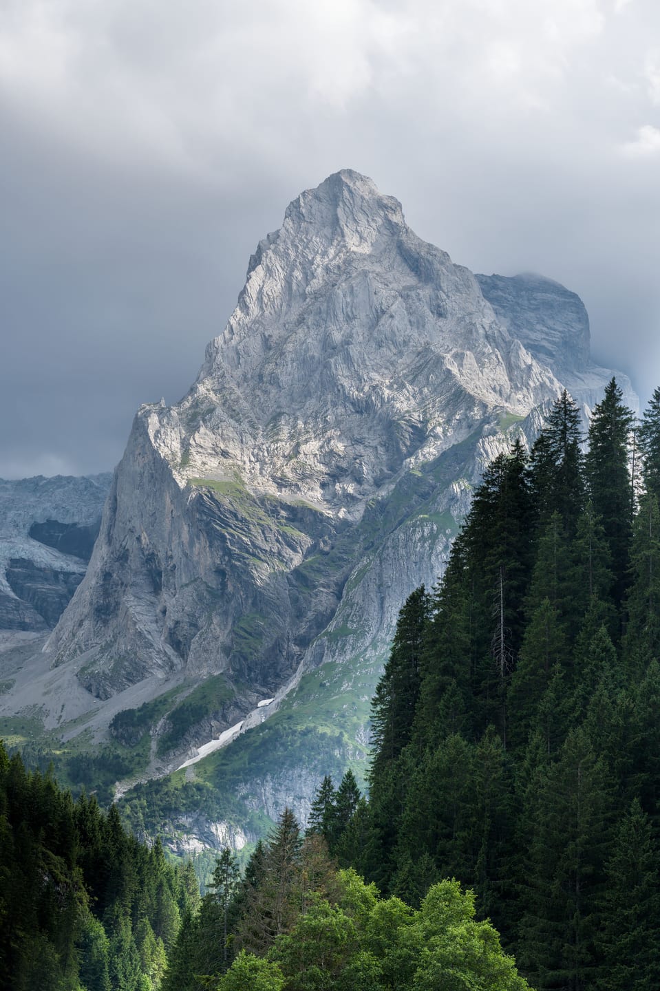 A rugged alpine peak rising above the surrounding Swiss landscape