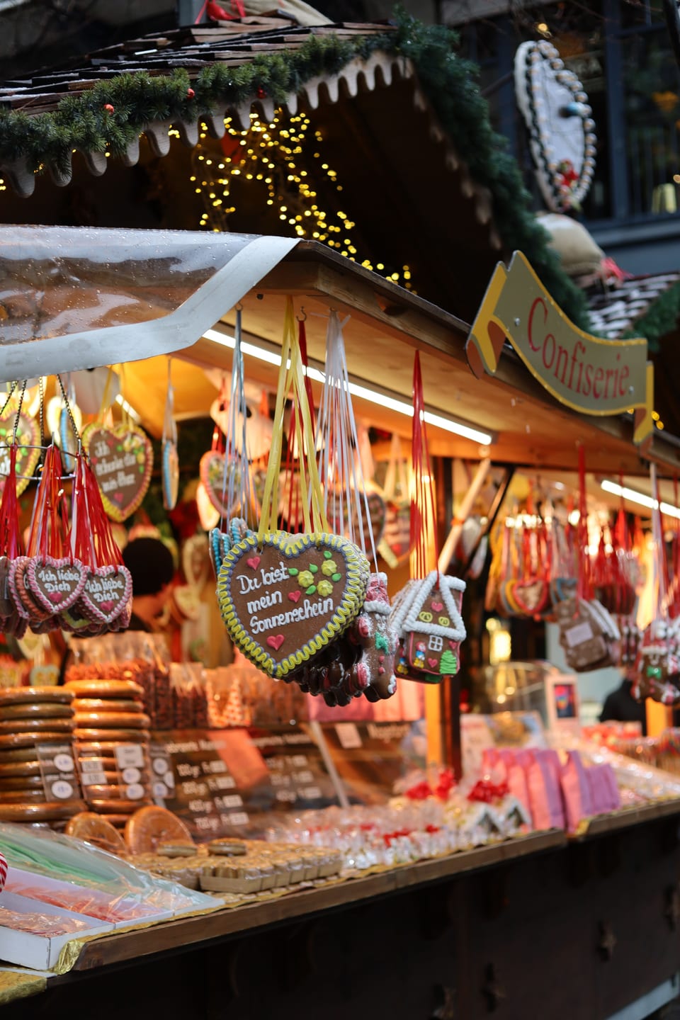 A confectionery stall decorated with gingerbread hearts and colourful sweets