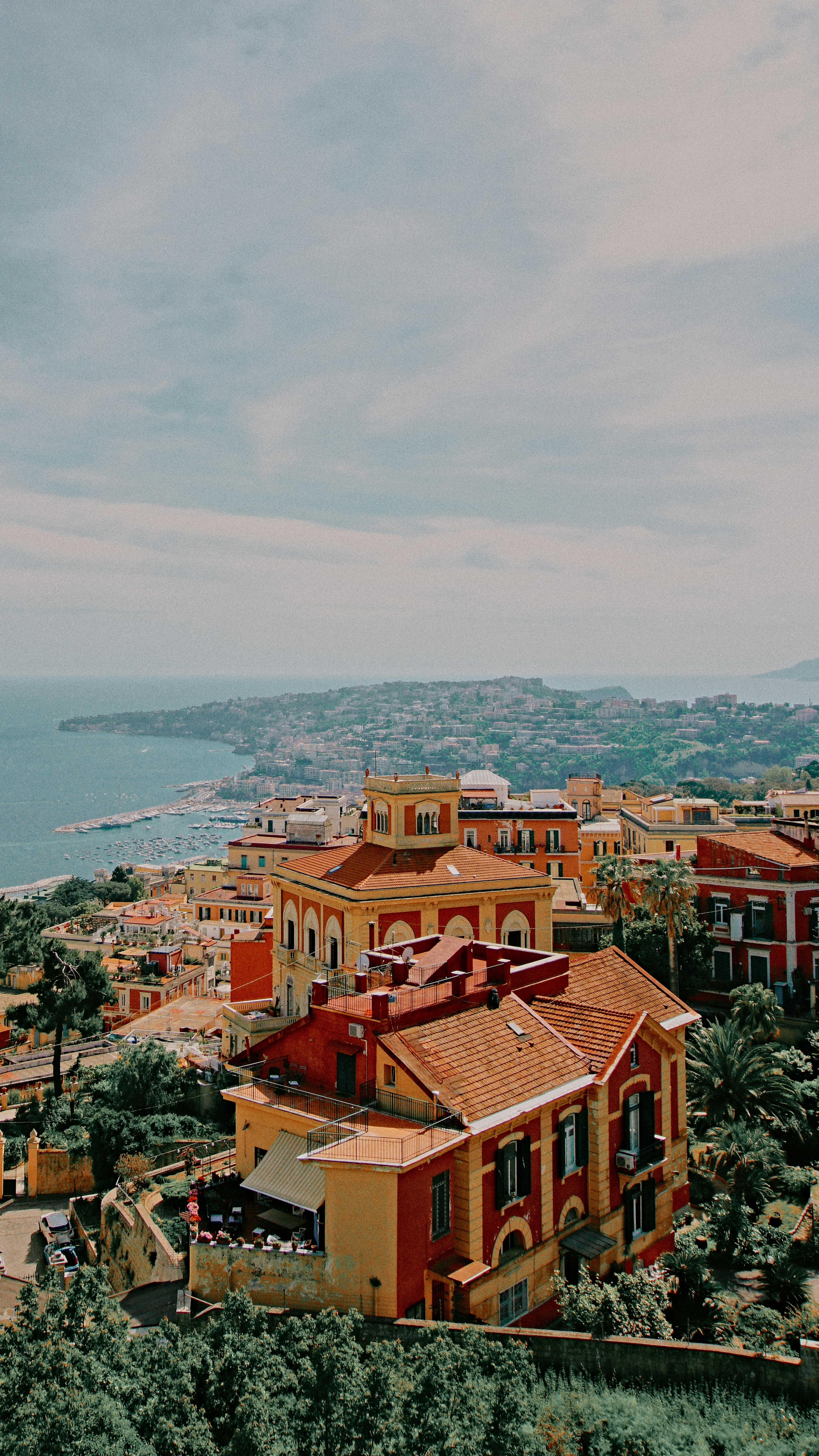 Colorful buildings on a hillside overlooking the Bay of Naples.