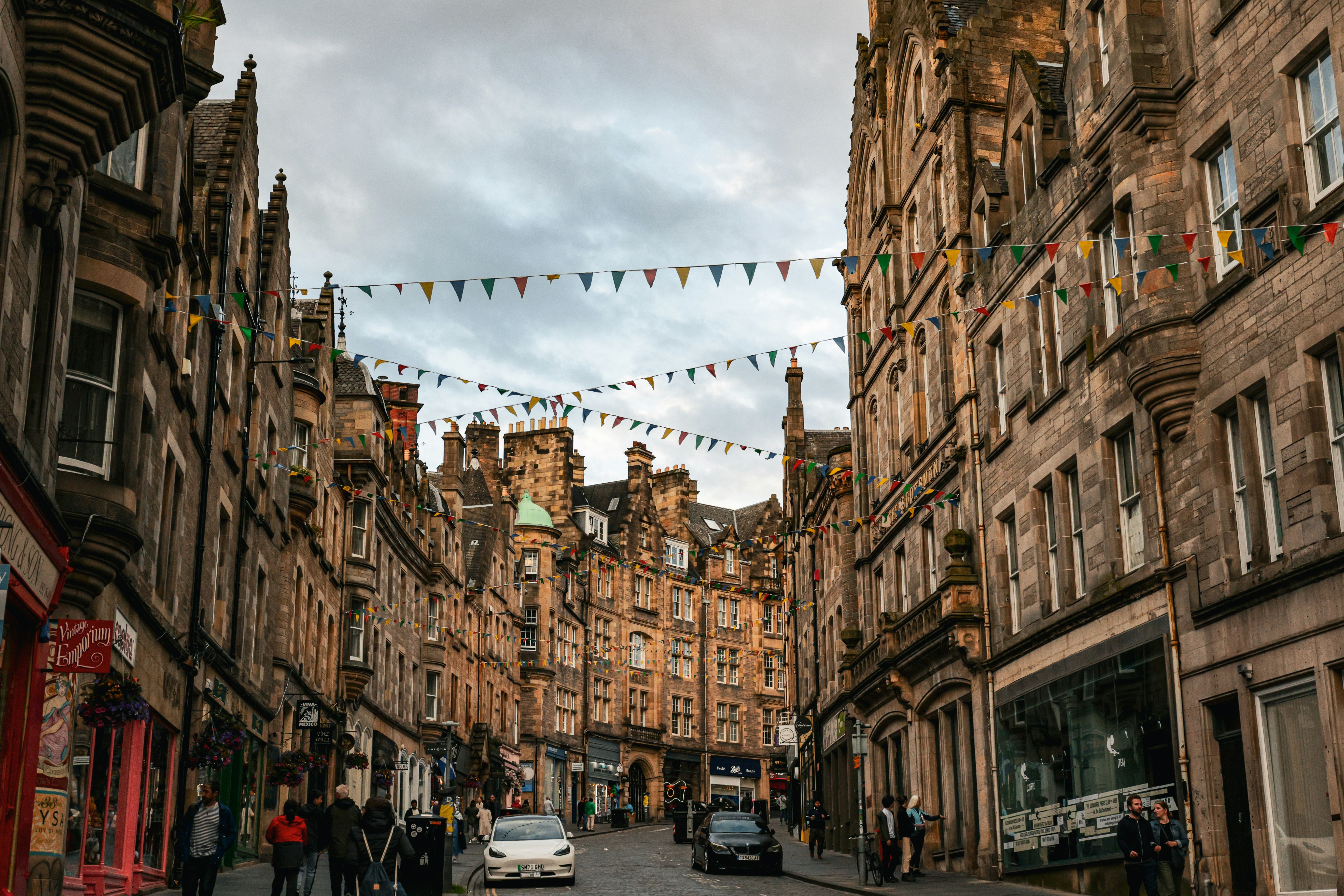 A historic Old Town street in Edinburgh decorated with bunting